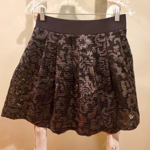 Express black faux leather Floral design pleated mini skirt. NWT Size Small.